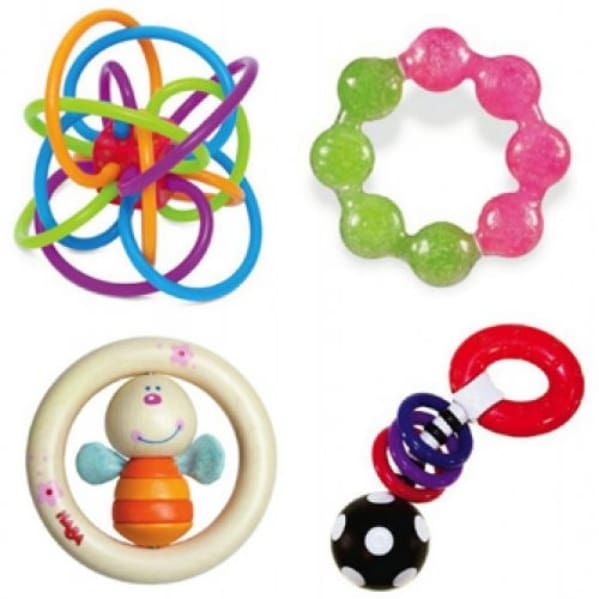 A variety of baby toys are arranged in a row.