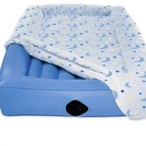 A blue bed with an air mattress on top of it.