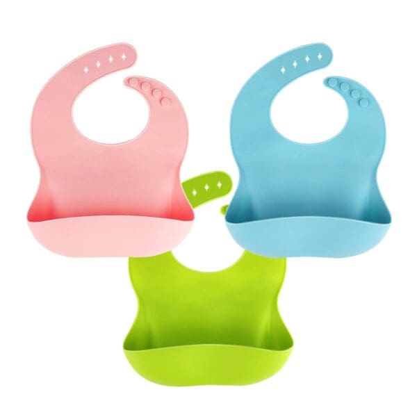 A set of three baby bibs in different colors.