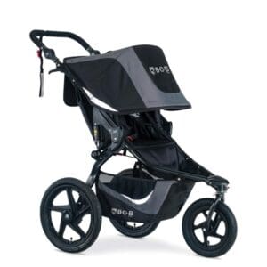 A stroller that is black and grey with a canopy.