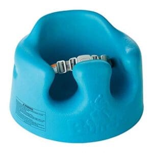 A blue bumbo seat with a strap around it.