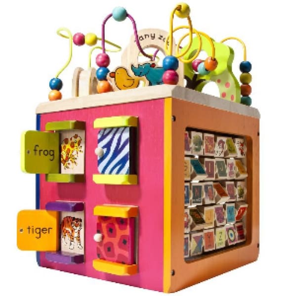 A toy box with many different toys on top of it.