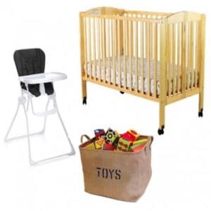 A baby crib, high chair and toy basket.