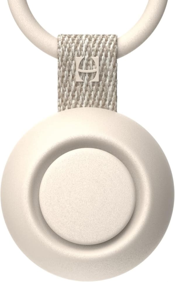 A white button with a strap around it