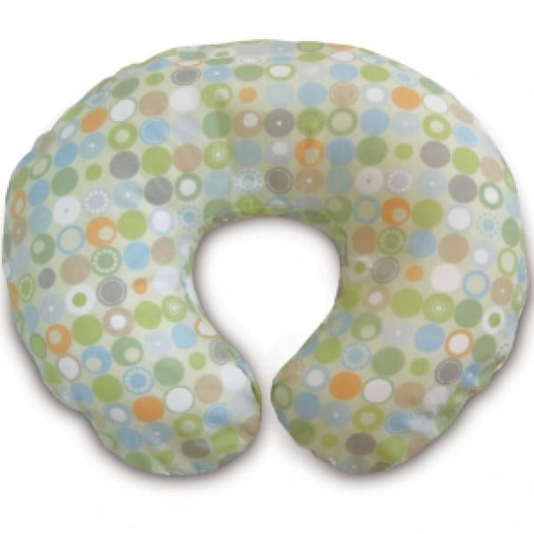 A white and green polka dot pillow with a blue dot pattern.