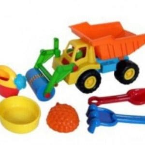 A toy truck and other toys are laying on the ground.