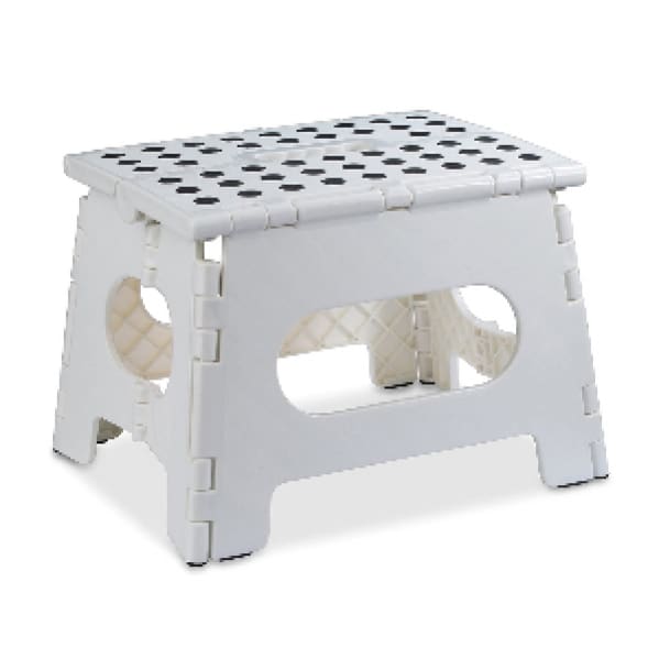 A white step stool with two circles on the top.