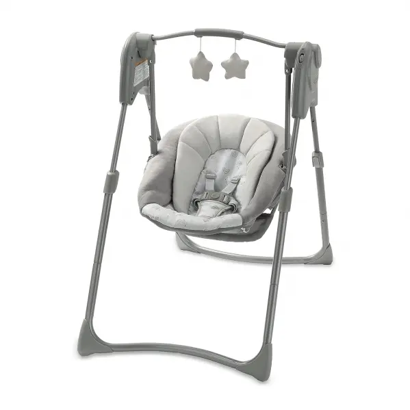 A baby swing with two stars hanging from it.