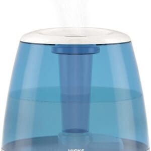 A blue and white humidifier is sitting on the floor.